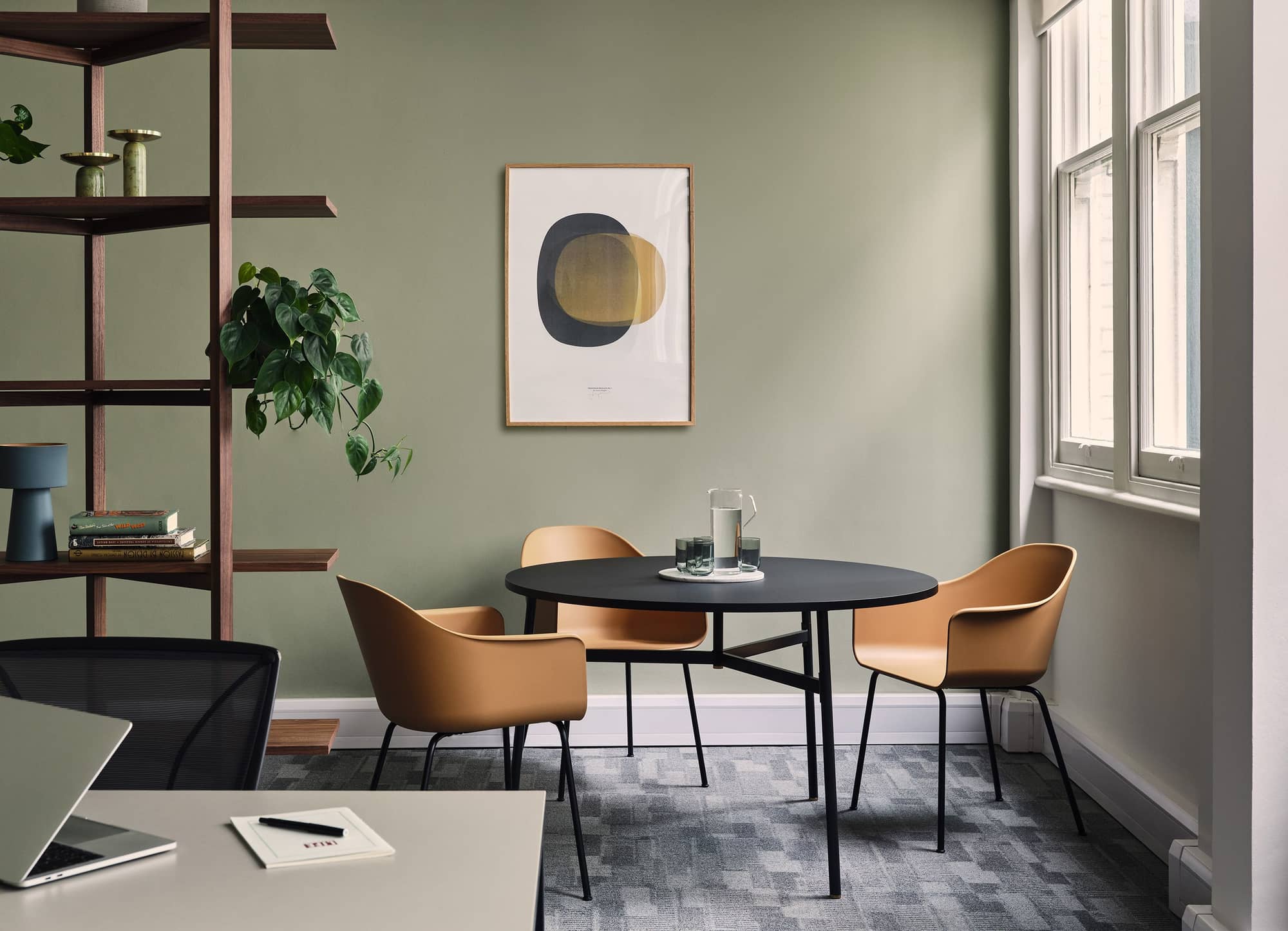 Modern mid-century round table with four chairs at Warnford Court.