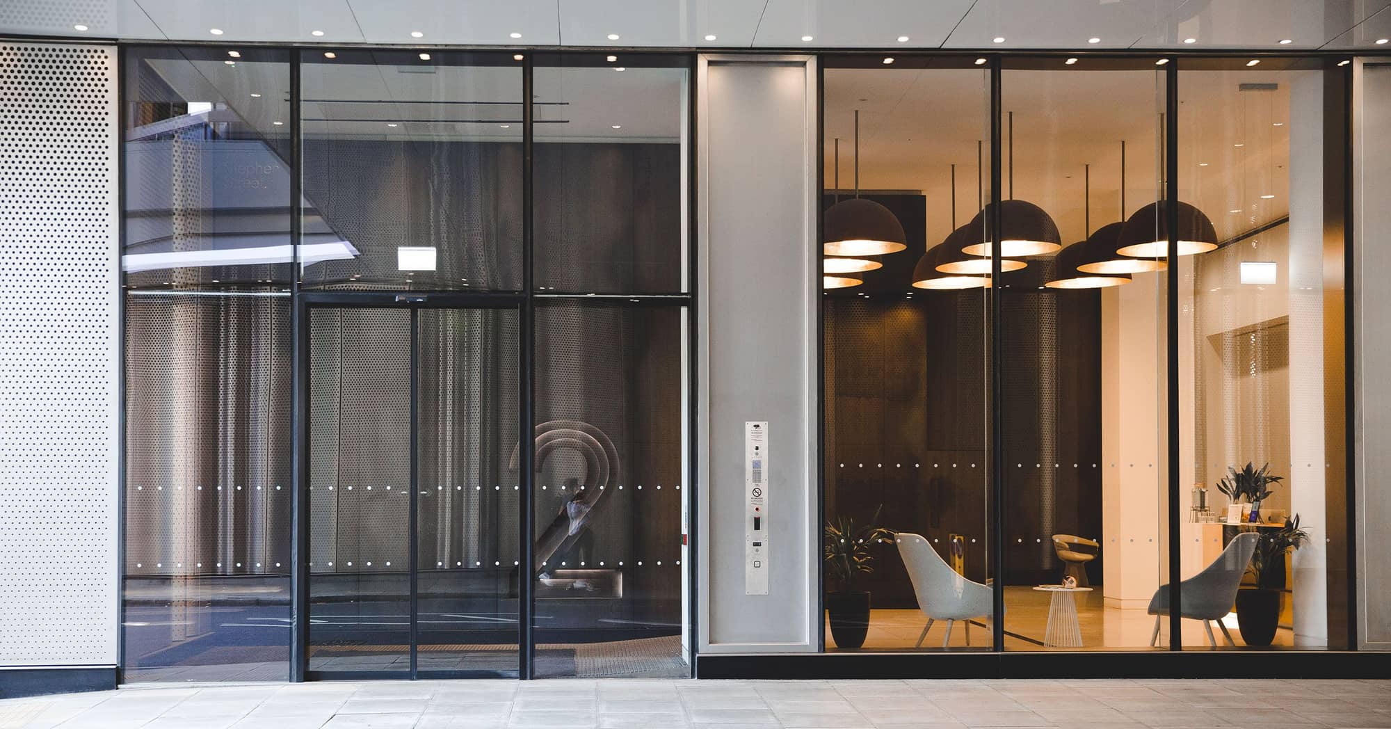 External view of the glass fronted, modern entrance of 2 Stephen Street.