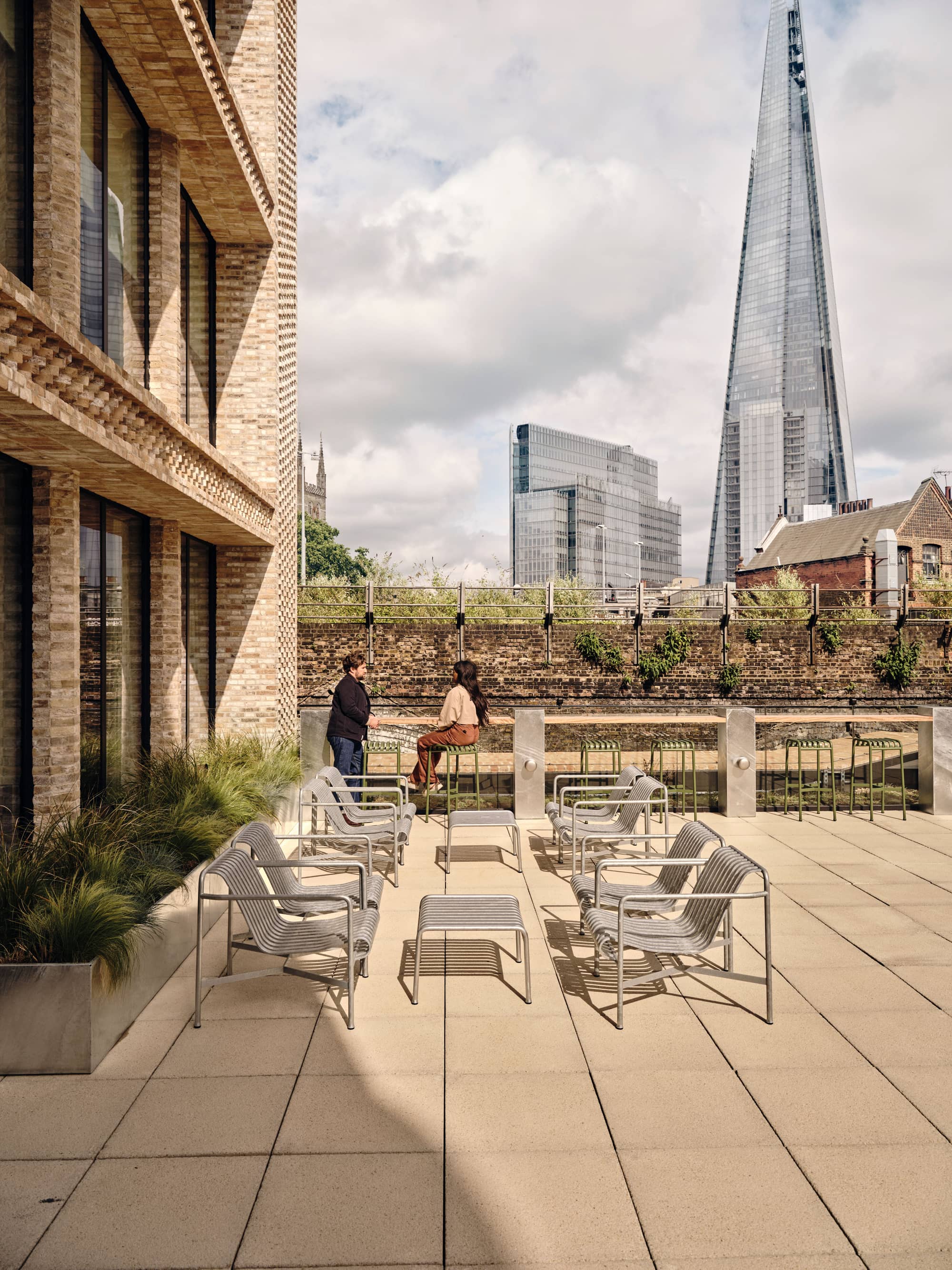 Outdoor seating area at Borough Yards with a view of The Shard.