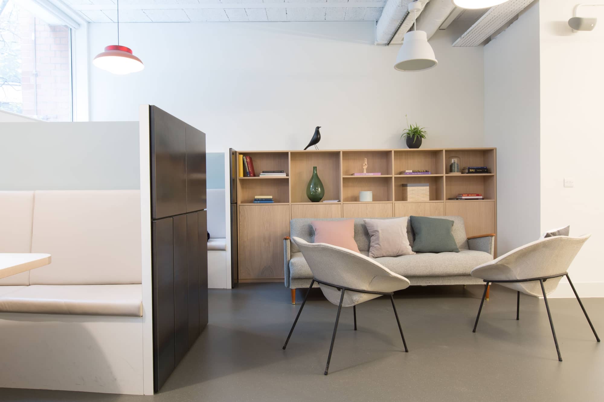 Modern communal area with sofa and coffee table at Lloyds Avenue.