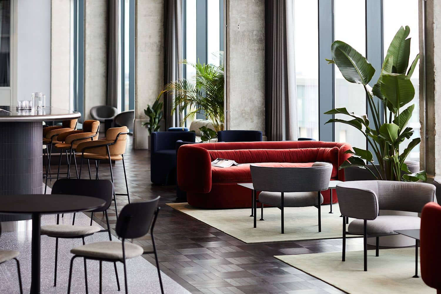 Bar area with various seating at Fora's One Lyric Square workspace.