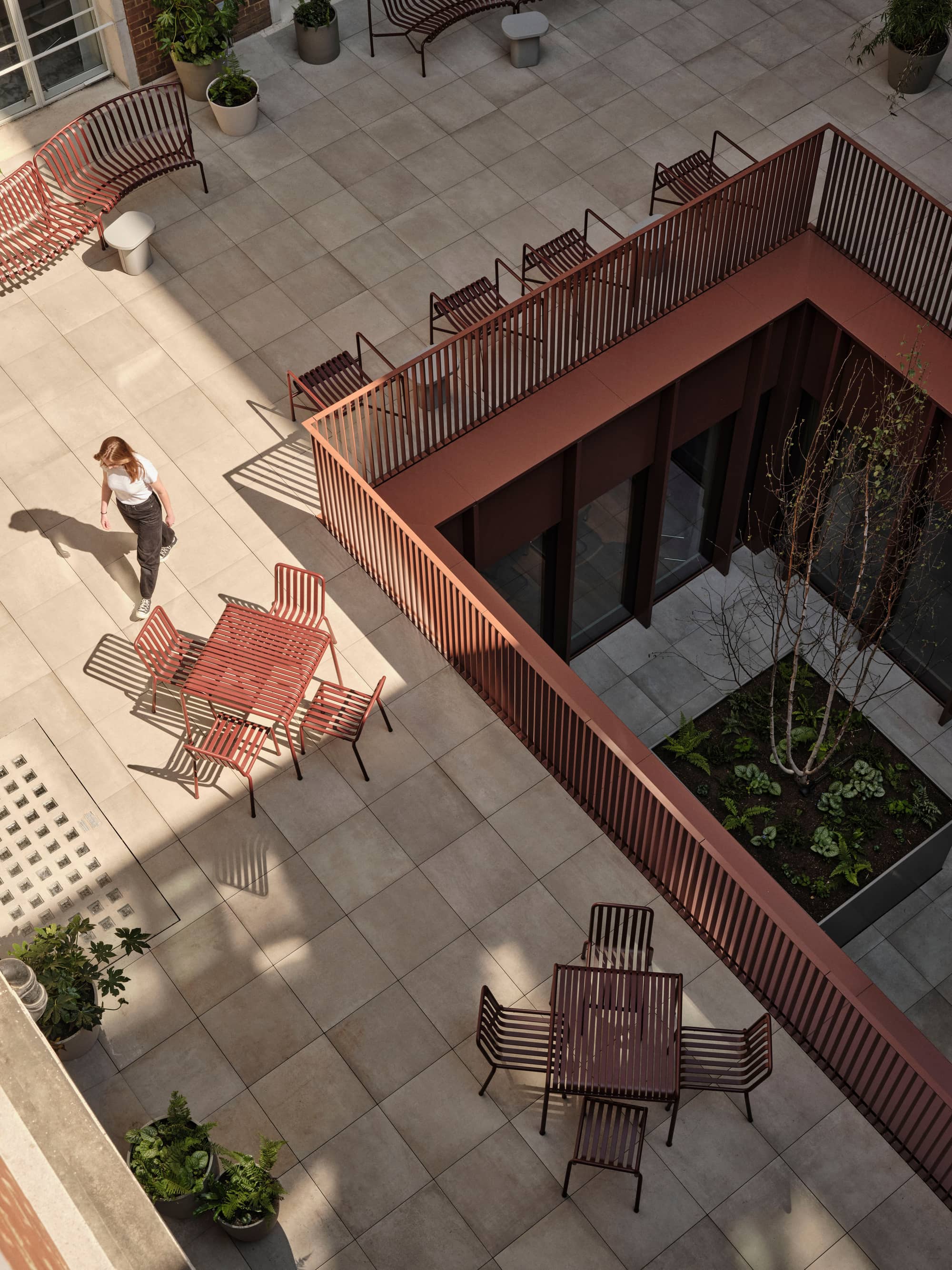 Outside seating area with modern furniture at Chancery House workspace.