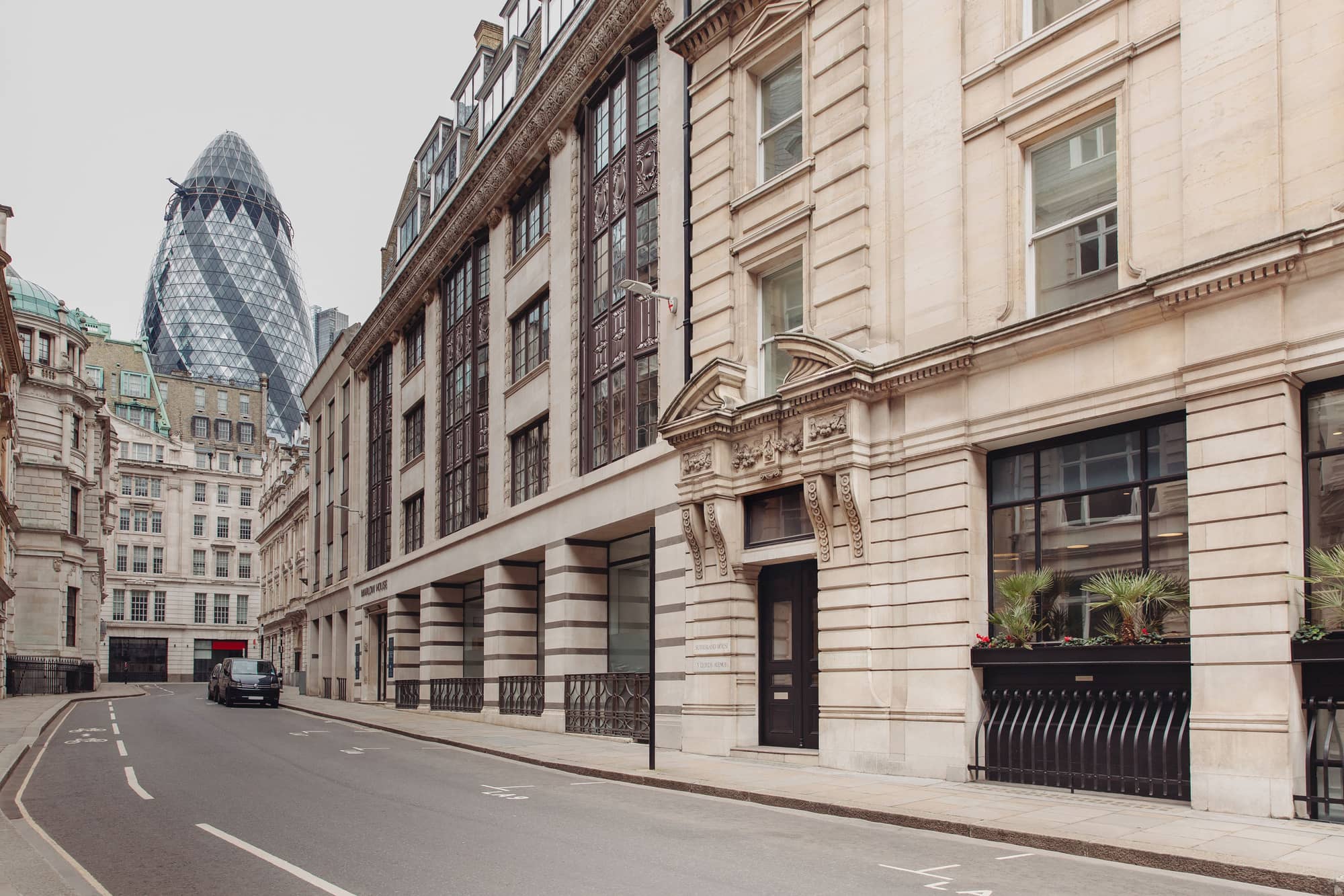 Road to Lloyds Avenue with The Gherkin in the background.
