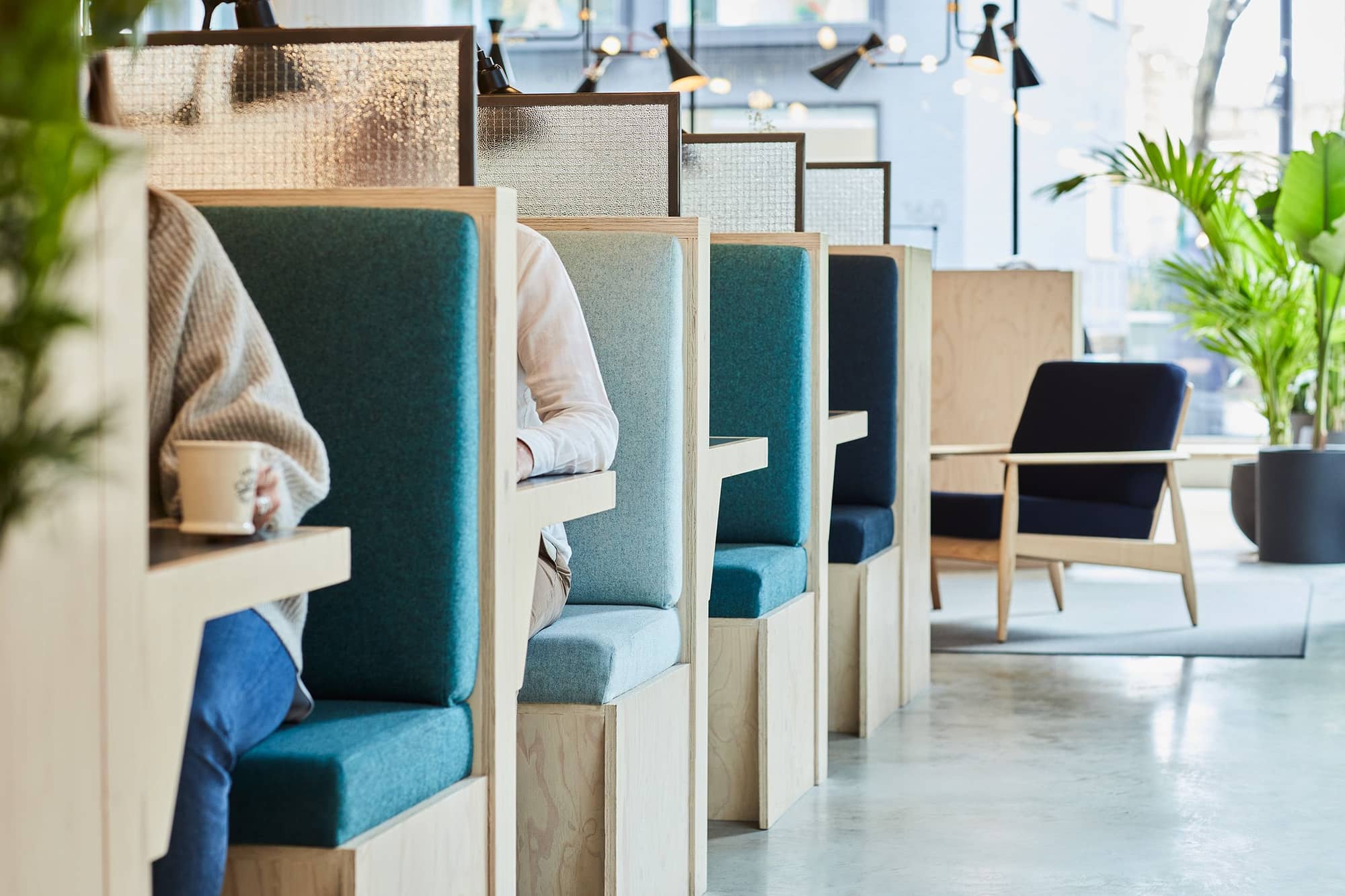 Modern seating booths at the 201 Borough High Street workspace.