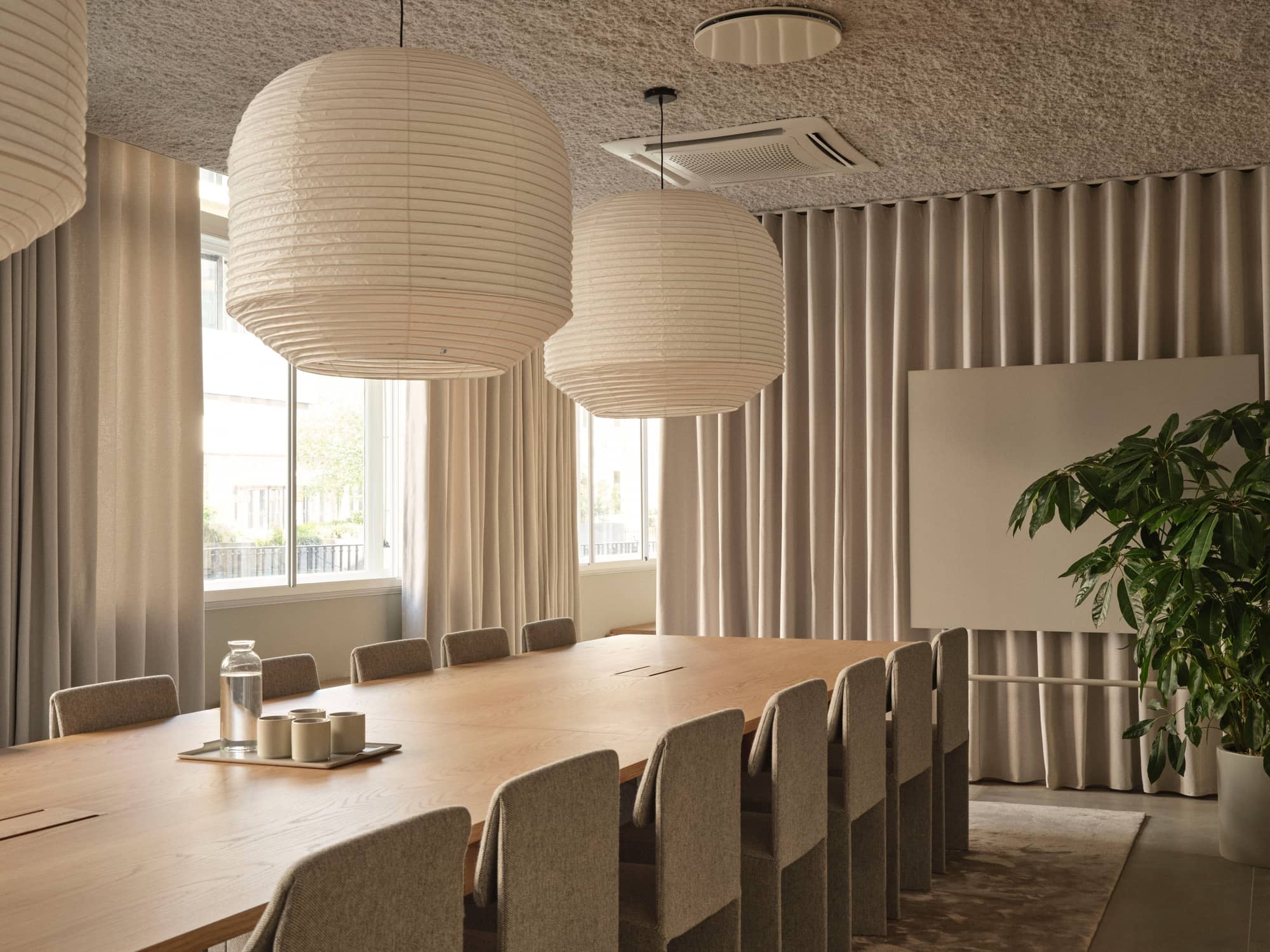 Modern meeting room with contemporary furniture in muted colours.